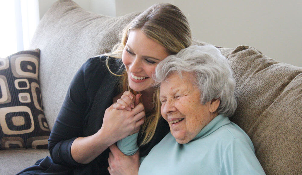 smiling older lady with female companion