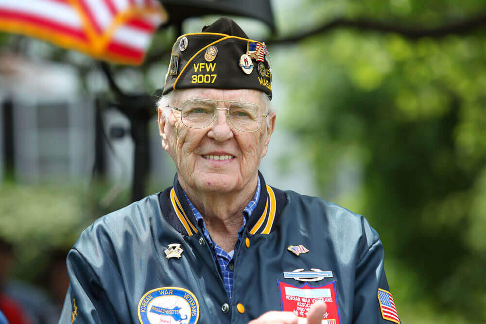 veteran in hat and windbreaker